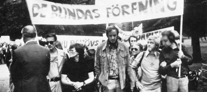 black and white photograph of a 1970s demonstration with banners 