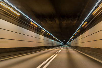 A highway tunnel at night
