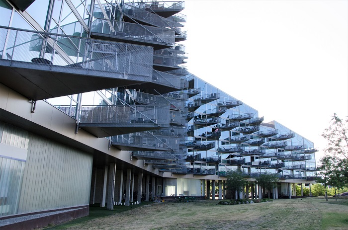  A housing complex made out of glass. What is special about this complex is that the balconies are triangular made by glass aswell. From far away, the balconies together look like spikes.