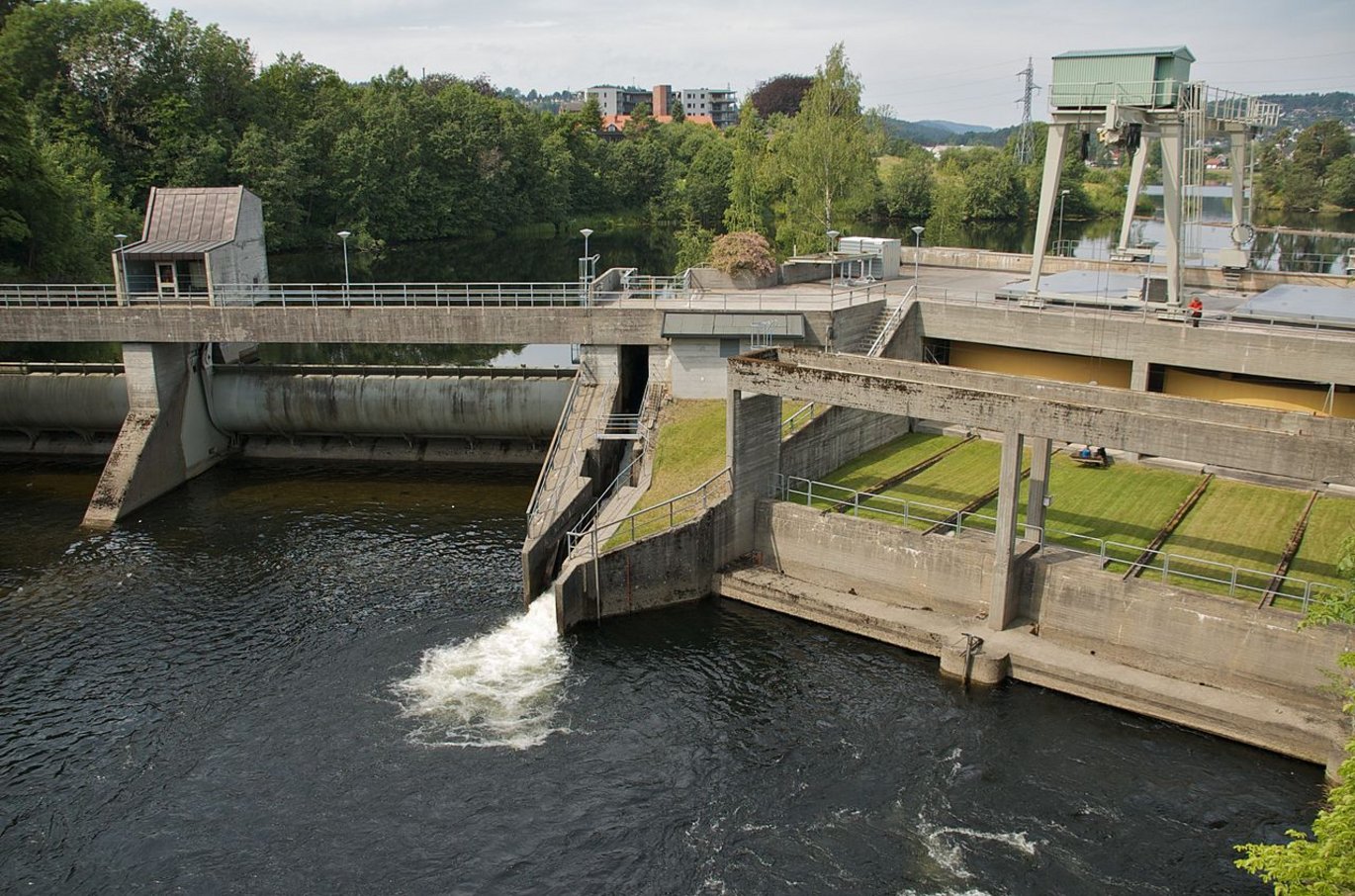 A hydropower plant. Lake with lots of water and with walls around it