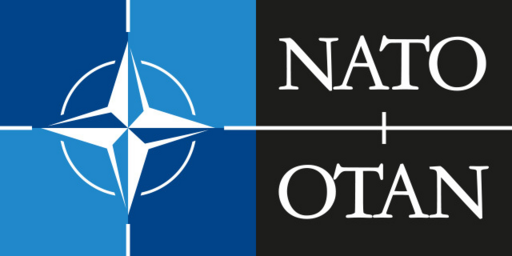 A picture of an abstract compas with the text 'NATO' and 'OTAN'.