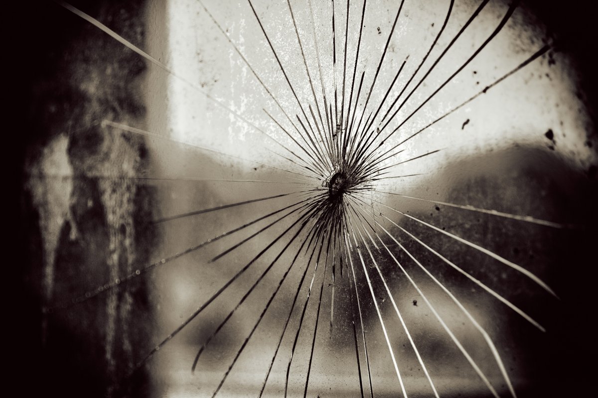 A black and white smashed window.