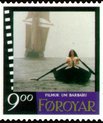 Faroe stamp with still from Nils Malmros' film Barbara, set in the Faroe Islands. On the still is a person rowing a small boat.