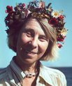 Finnish author Tove Jansson, portrayed wearing a flower crown, 1967.