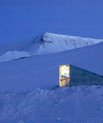 A seedvault hidden in the snow at night