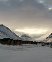 A small arctic village. Small houses next to each other in a snow landscape.