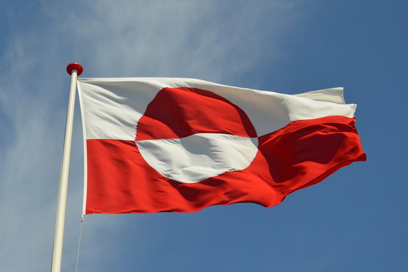 the Greenlandic flag waving in the wind