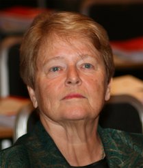 Colour photo of Gro Harlem Brundtland looking up and looking serious