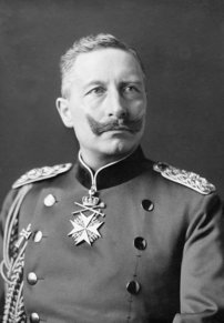 A portrait of an elder man looking up to the right. He has a moustache and is wearing a royal uniform with gold badges.