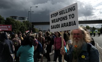 A demonstration against the arms trade in London, 9 September 2017. Woman holding a sign saying "stop selling weapons to Saudi Arabia"