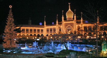 Tivoli, a little amusement park in Copenhagen, Denmark, lighting up at night