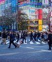 A crowd of people walking the streets of Tokyo in Japan. 
