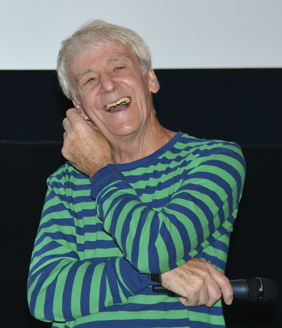 A portrait of a laughing Colin Nutley in 2014.