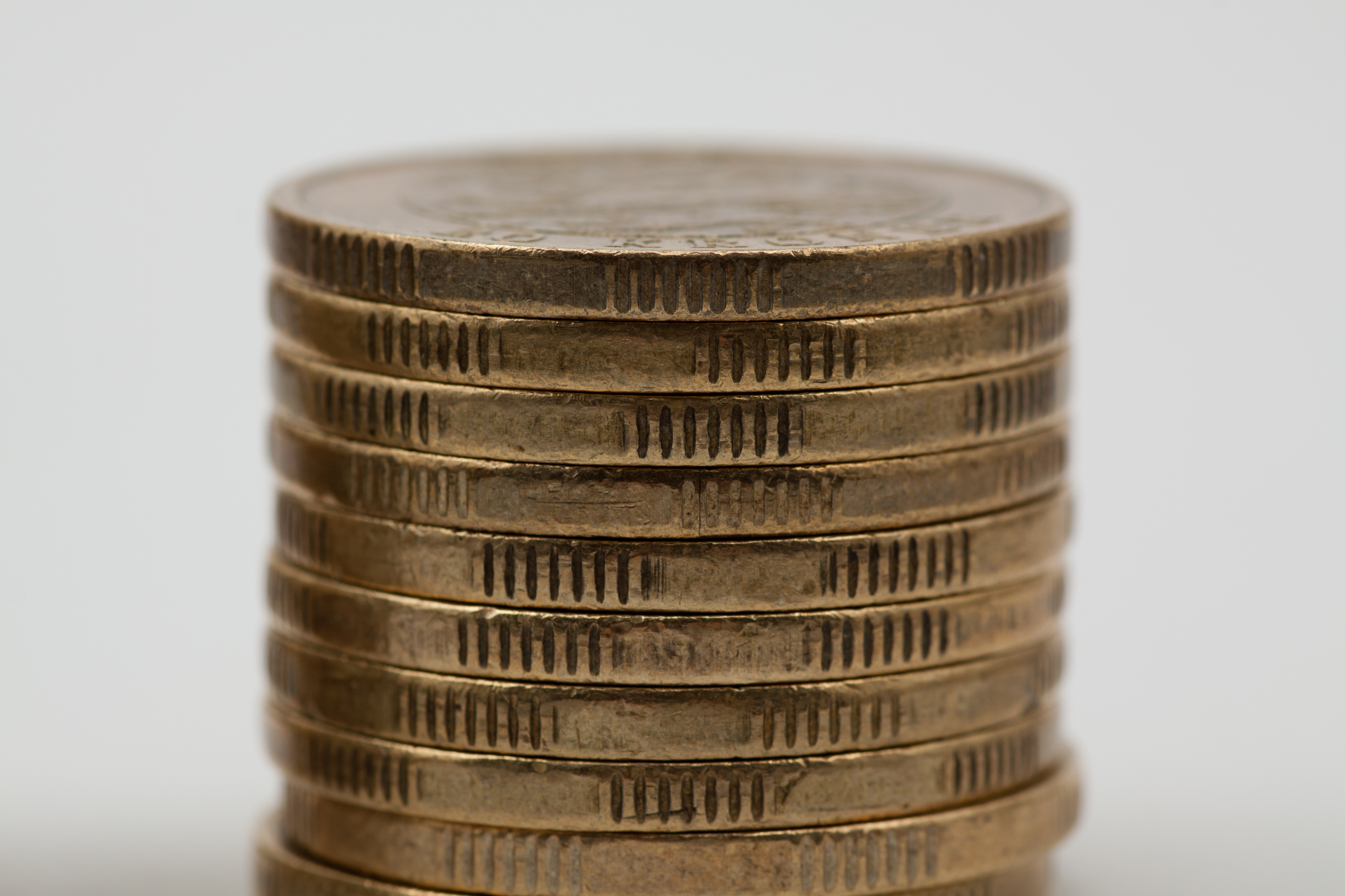 a stack of gold coins on top of each other