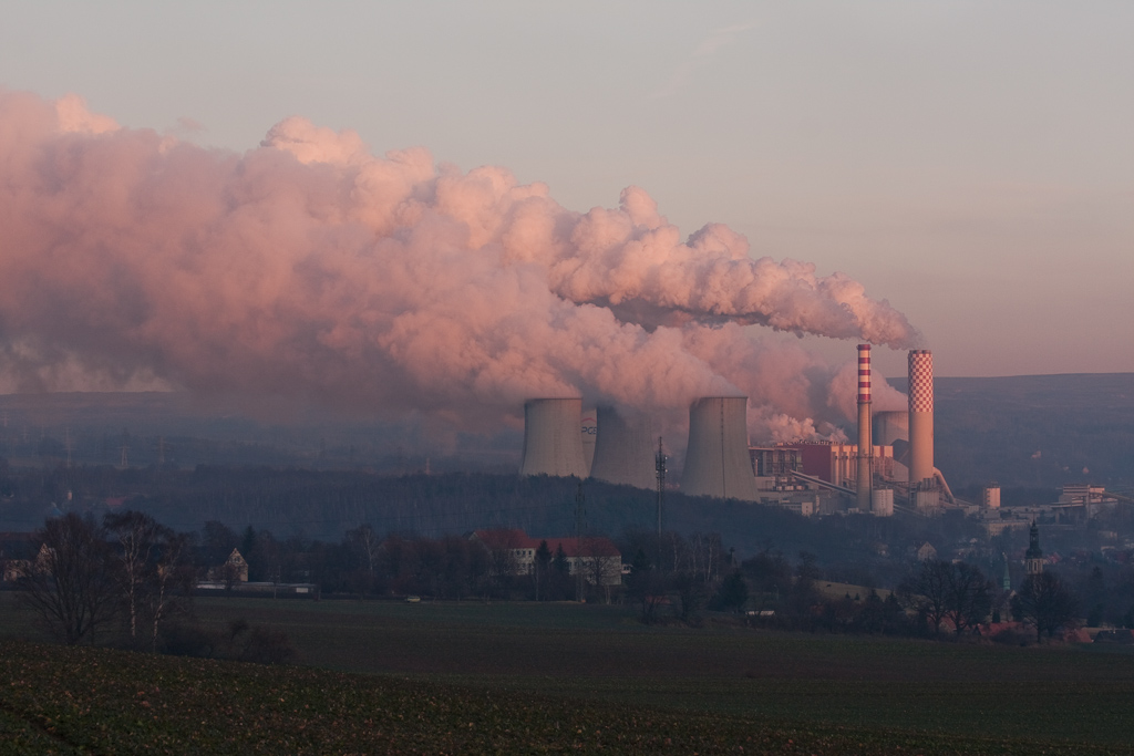 The Turów thermal power plant in Bogatynia, Poland, viewed from Germany. The power plant is seen active with smoke coming out.