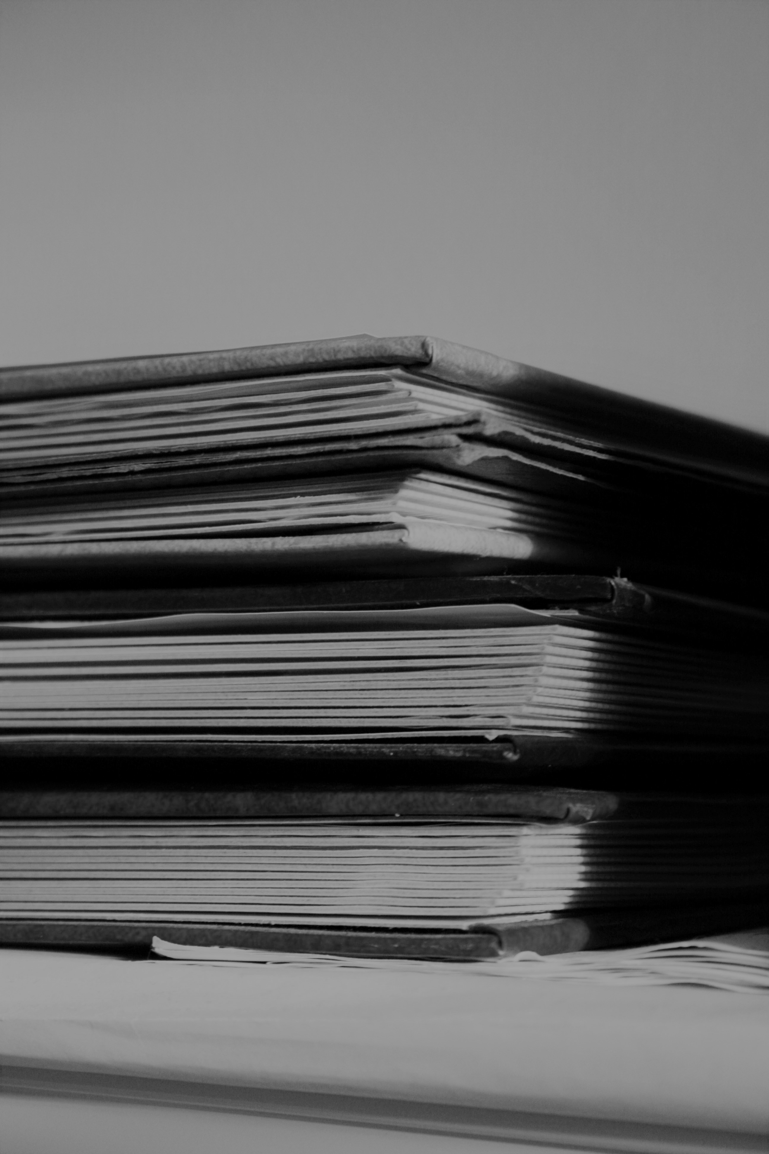 Black and white photo of stacked books